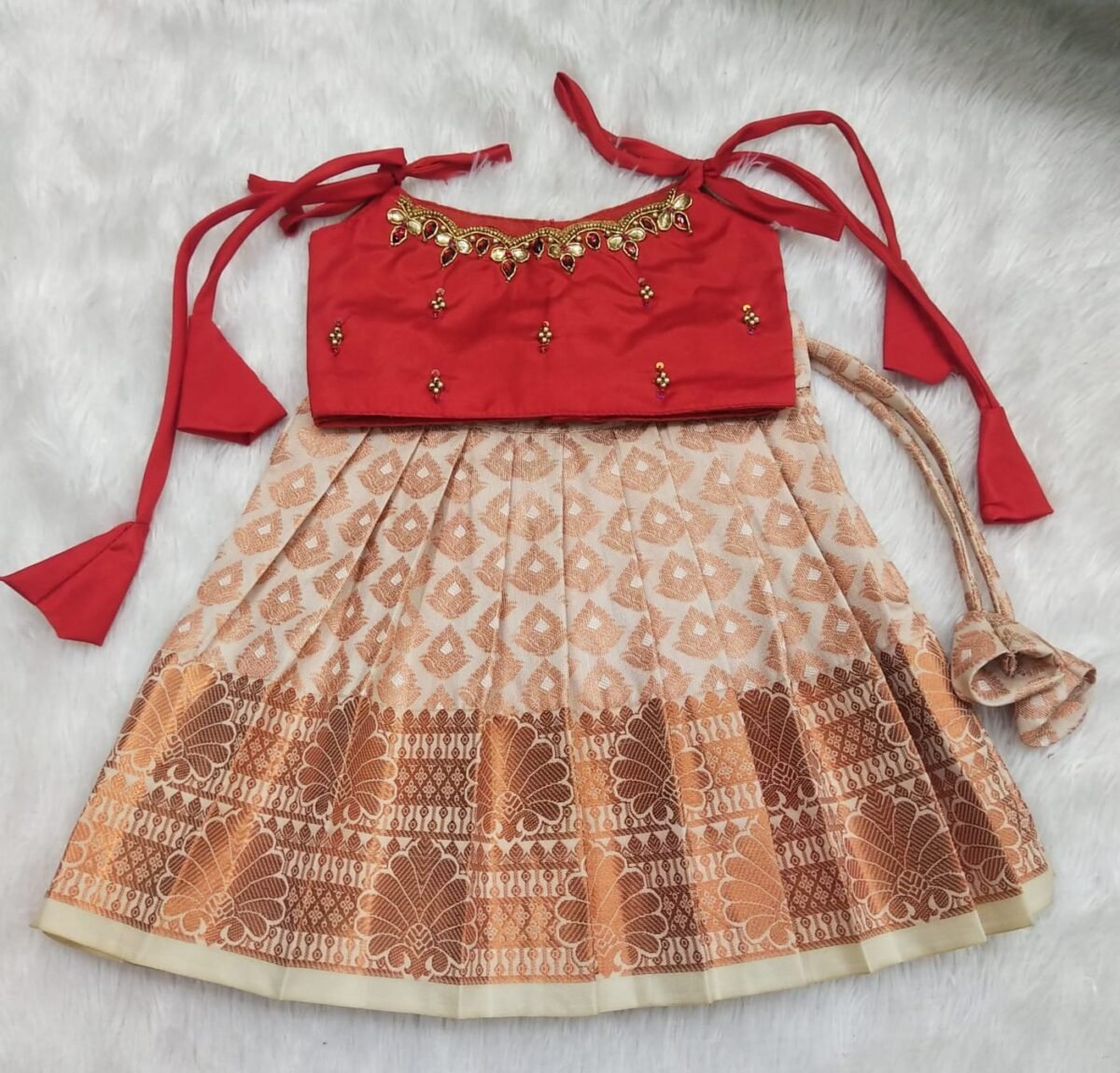 Kanchi Pattu Pavadai with Knotted Sleeves and Intricate Aari Work